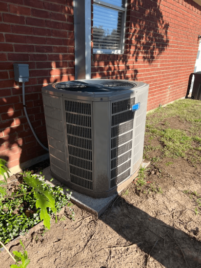 An outdoor AC unit Heat Pump Repair Service Keller TX | AC & Heat Solutions